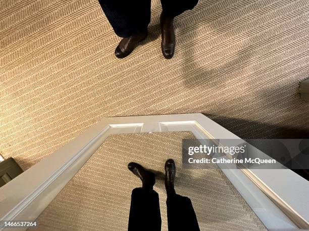 well-dressed woman standing in front of closet mirror - eitelkeit stock-fotos und bilder