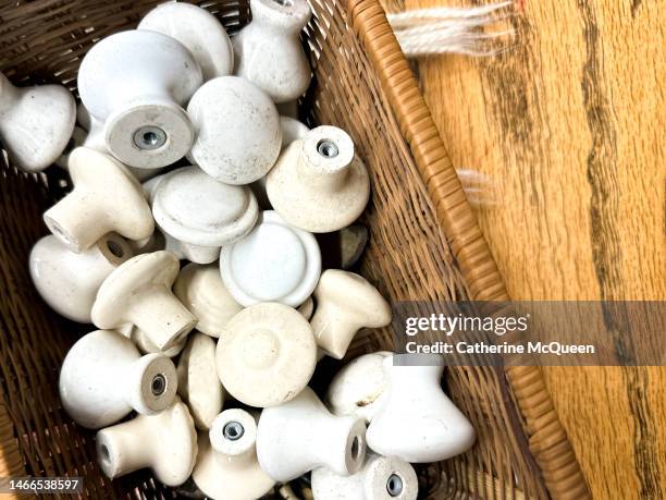 basket of antique knobs - shabby chic stockfoto's en -beelden