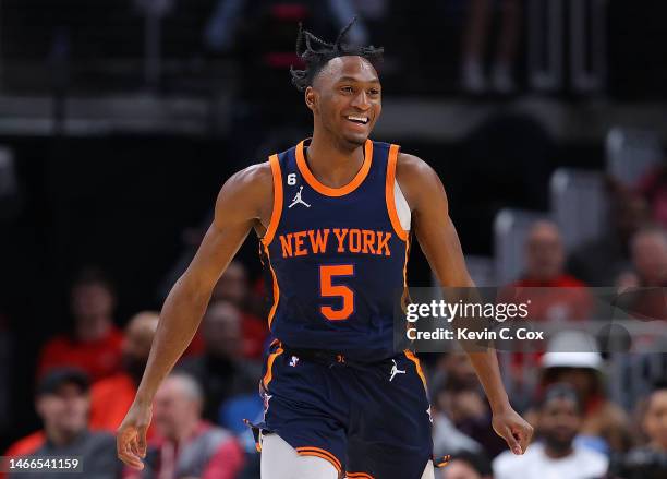 Immanuel Quickley of the New York Knicks reacts after a three-point basket against the Atlanta Hawks during the fourth quarter at State Farm Arena on...