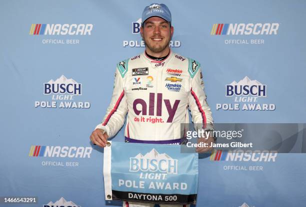 Alex Bowman, driver of the Ally Chevrolet, poses for photos after winning the the Busch Light Pole Award at Daytona International Speedway on...