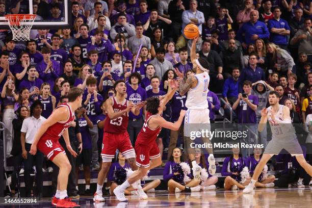 Boo Buie of the Northwestern Wildcats shoots a game-winning floater against the Indiana Hoosiers during the second half at Welsh-Ryan Arena on...