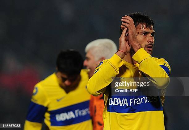 Footballers of Argentina's team Boca Juniors celebrate at the end of the Libertadores Cup second leg semifinal match against Chile's Universidad de...