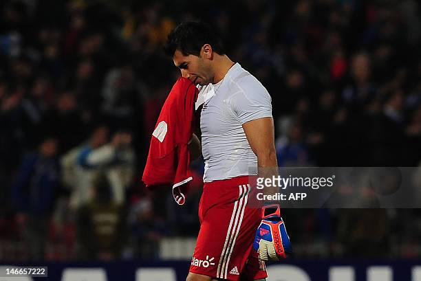 Goalkeeper Johnny Herrera, of Chile's team Universidad de Chile, shows his dejection at the end of the Libertadores Cup second leg semifinal match...