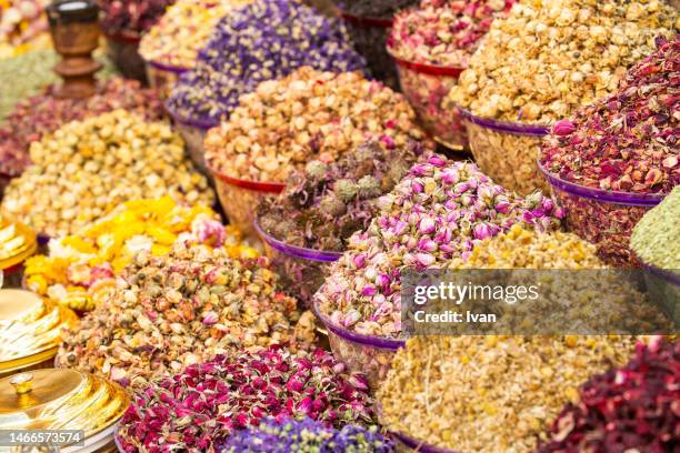 bags of colorful spices and herb for sale at the souq market - basil sellers stock pictures, royalty-free photos & images