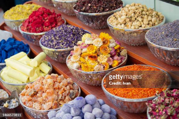 bags of colorful spices and herb for sale at the souq market - basil sellers stock pictures, royalty-free photos & images