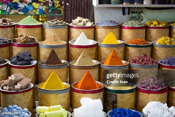 bags of colorful spices and herb for sale at the souq market - artisan food bildbanksfoton och bilder