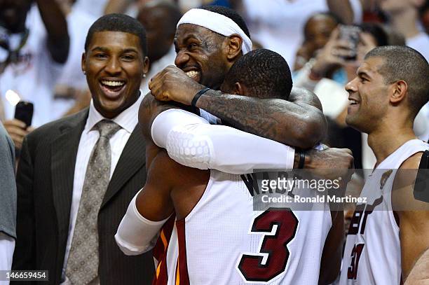 LeBron James and Dwyane Wade of the Miami Heat celebrate late in the fourth quarter against the Oklahoma City Thunder in Game Five of the 2012 NBA...