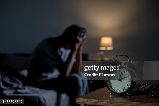 Depressed senior Asian man sitting in bed cannot sleep from insomnia Depressed senior Asian man sitting in bed cannot sleep from insomnia