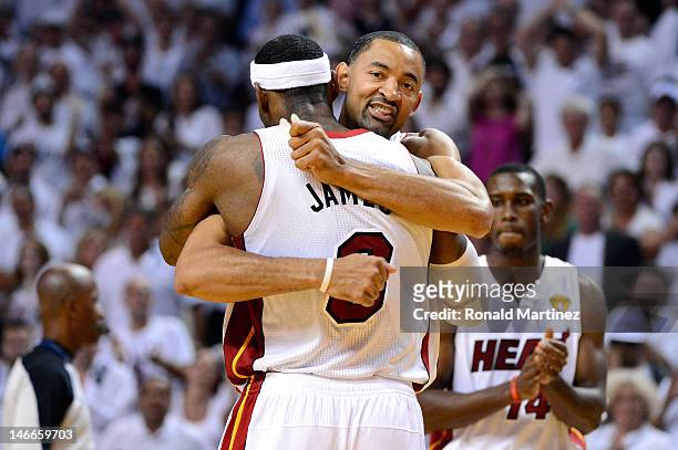 Juwan Howard of the Miami Heat celebrates with LeBron James late in the fourth quarter against the Oklahoma City Thunder in Game Five of the 2012 NBA...