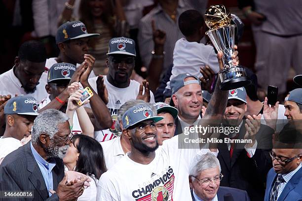 LeBron James of the Miami Heat celebrates with the Bill Russell Finals MVP trophy after they won 121-106 against the Oklahoma City Thunder in Game...