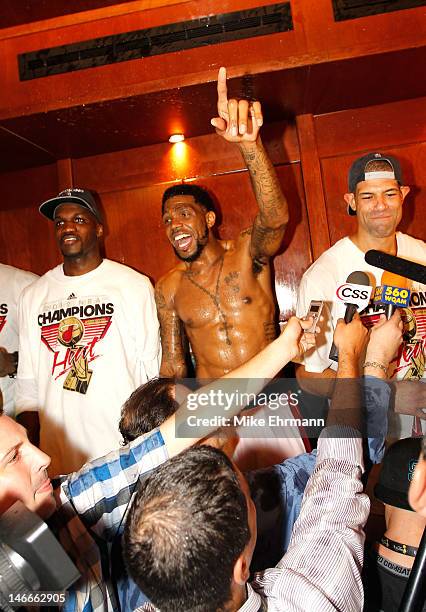 Joel Anthony, Udonis Haslem and Shane Battier of the Miami Heat celebrate in the locker room after they won 121-106 against the Oklahoma City Thunder...