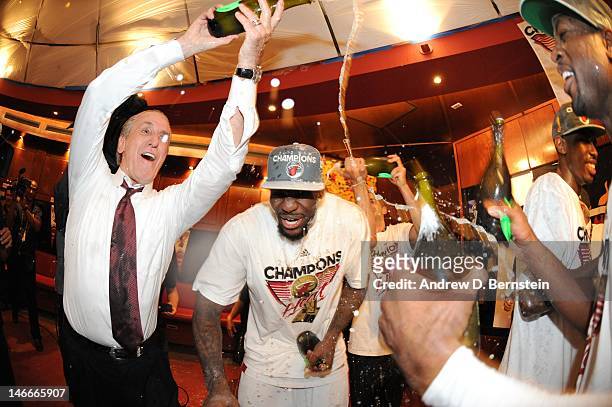 LeBron James of the Miami Heat celerates with Miami Heat team President Pat Riley in a locker room after winning Game Five of the 2012 NBA Finals...