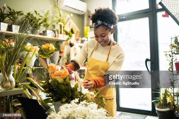 young female florist - florest stock pictures, royalty-free photos & images