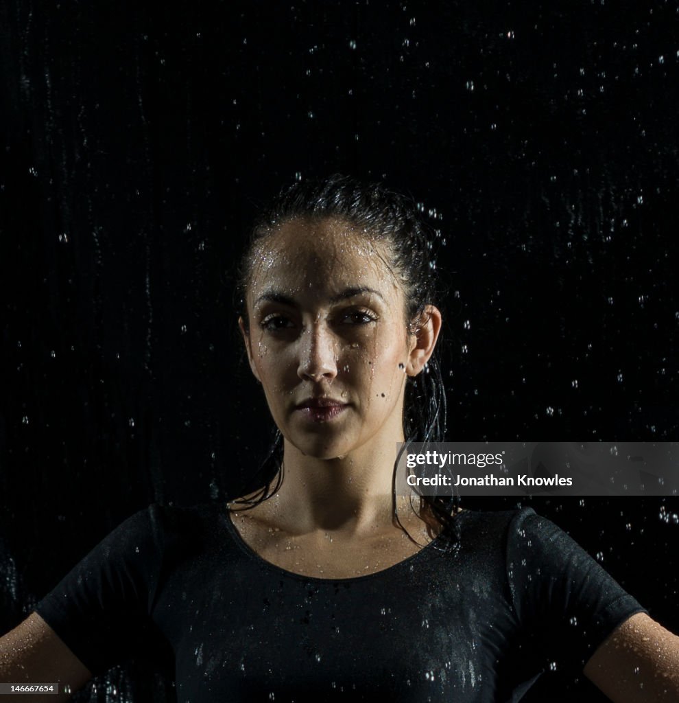 Portrait of a female athlete in rain