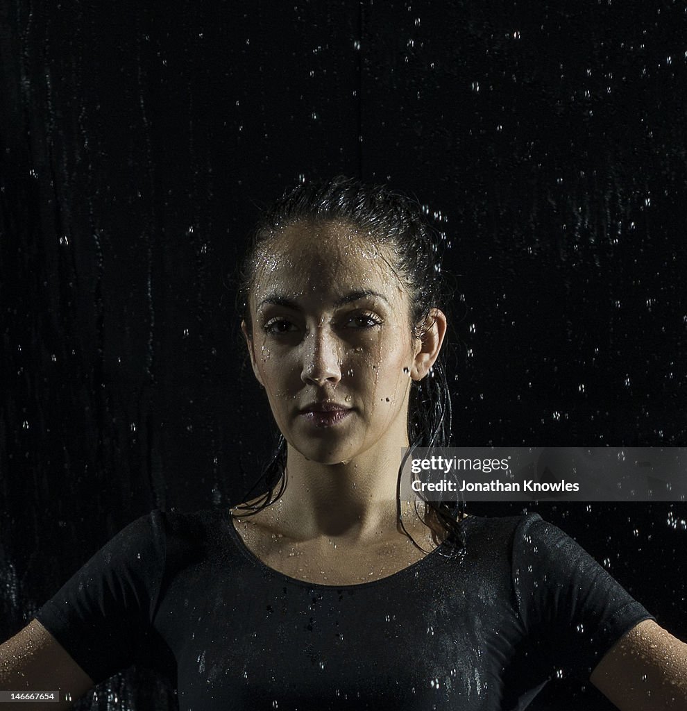 Portrait of a female athlete in rain