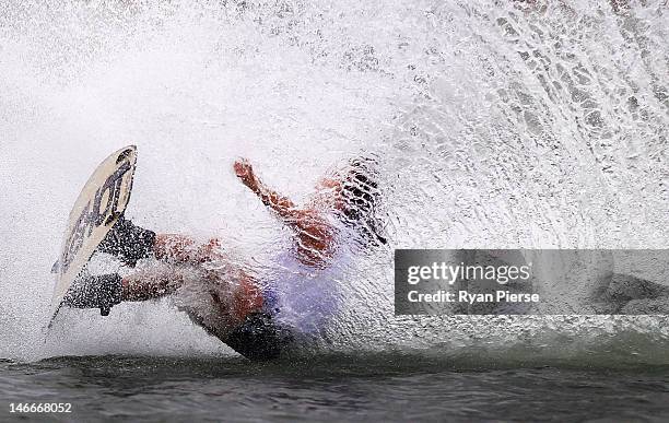 Miku Asai of Japan crashes out during the Waterski Women's Wakeboard Final on Day 6 of the 3rd Asian Beach Games Haiyang 2012 at Jiulong Lake on June...