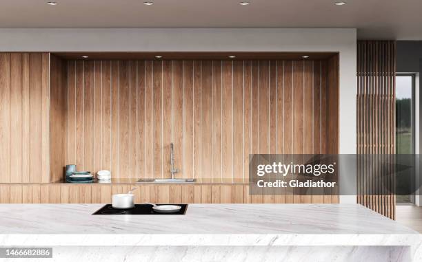 a close up of a modern white kitchen with rectangular marble breakfast kitchen island - kitchen island stock pictures, royalty-free photos & images