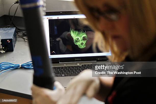 Quantico, VA Lisa Bailey, a forensic artist with the FBI, demonstrates how she does a 3D laser scan of a scull and discuss's the Laboratory's...