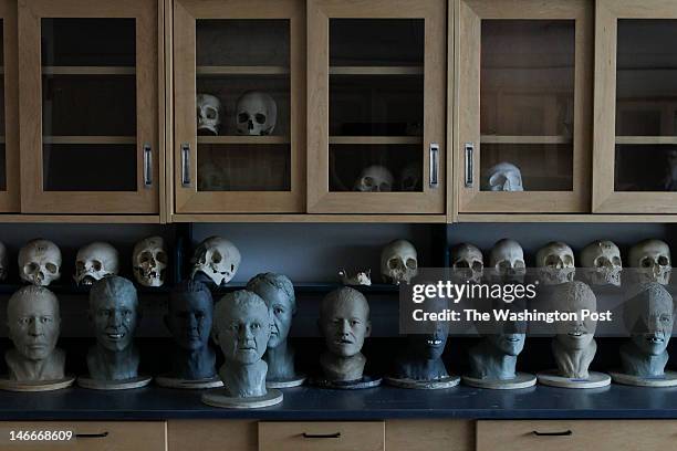 Quantico, VA completed Facial Approximations of unidentified found remains sit as Lisa Bailey, a forensic artist, and Dr. Richard Thomas, a forensic...