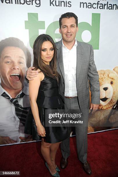 Mila Kunis and Scott Stuber arrives for the premiere of "Ted" at Grauman's Chinese Theatre on June 21, 2012 in Hollywood, California.