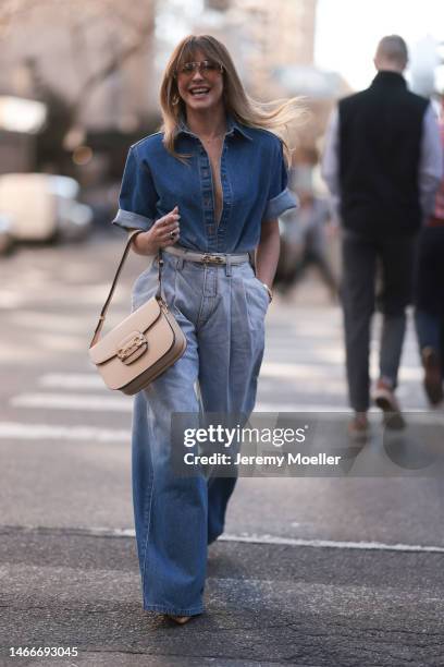 Julianne Hough seen wearing a denim look with a jeans blouse, a wide leg jeans, a Gucci bag, a beige belt and transparent shades before the Brandon...