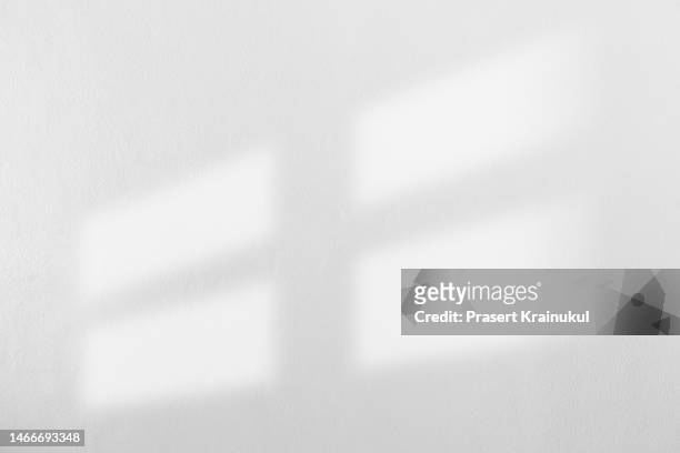 shadow on gray concrete wall - window curtains stock pictures, royalty-free photos & images