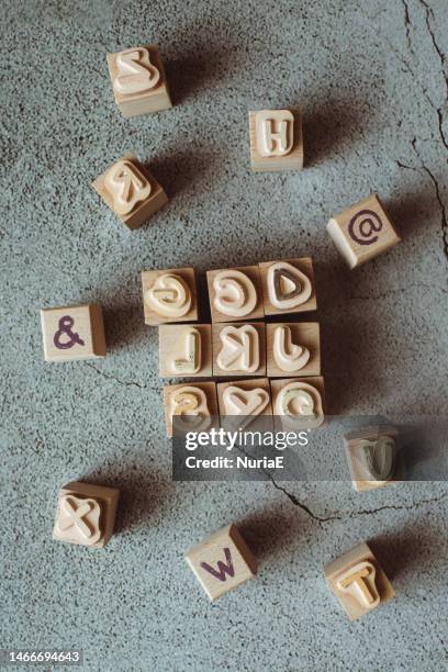 overhead view of wooden stamps with capital letters - table font view stock pictures, royalty-free photos & images