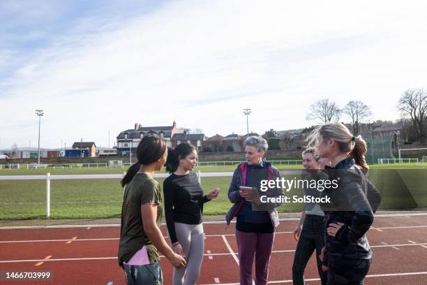 performance review with the coach - womens track stock pictures, royalty-free photos & images