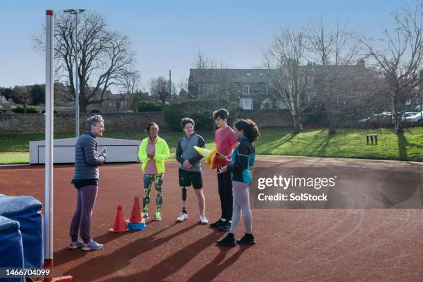 brief with the coach - womens track stock pictures, royalty-free photos & images