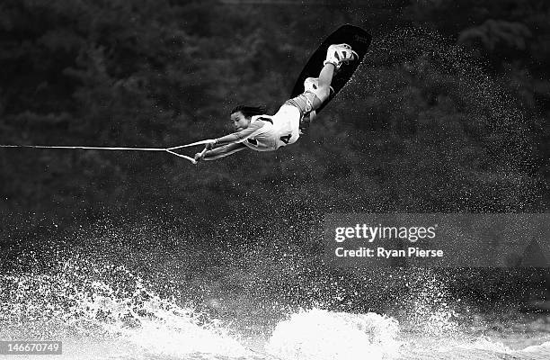 Zhenkun Duan of China competes in the Waterski Women's Wakeboard Final on Day 6 of the 3rd Asian Beach Games Haiyang 2012 at Jiulong Lake on June 22,...