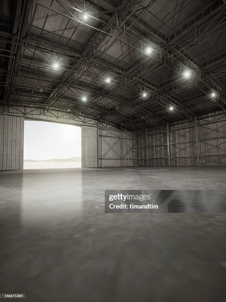 Empty hangar with lights on