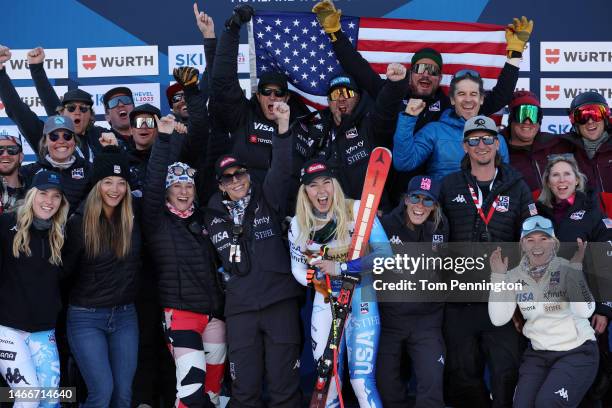 Gold medalist Mikaela Shiffrin of United States celebrates with team members during the victory ceremony for Women's Giant Slalom at the FIS Alpine...