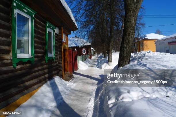 view of snow covered houses against sky,semyonov,nizhny novgorod oblast,russia - nizhny novgorod oblast stock-fotos und bilder