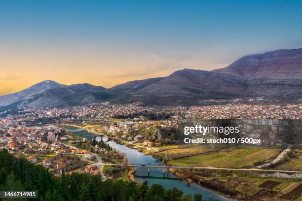 aerial view of townscape and mountains against sky,trebinje,bosnia and herzegovina - bosnia and hercegovina stock pictures, royalty-free photos & images