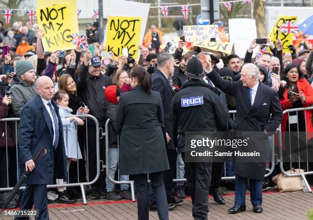 Protesters are seen in the crowd as King Charles III visits Milton Keynes which is celebrating its new status as a city, awarded as part of The late...