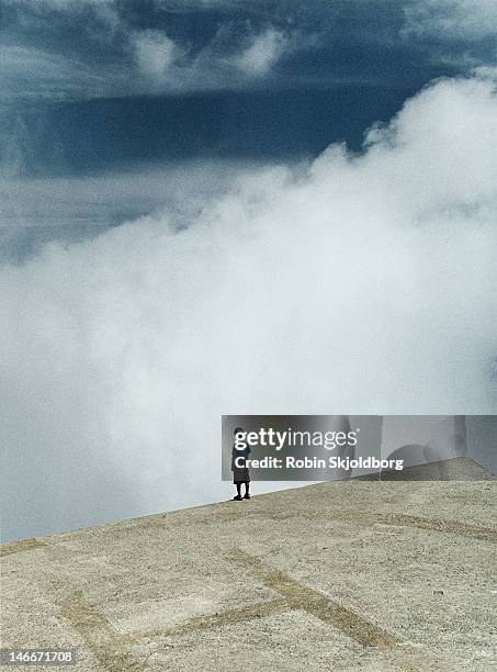 boy on hellicopter platform looking out - livorno italy stock pictures, royalty-free photos & images
