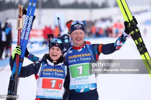 Marte Olsbu Roeiseland and Johannes Thingnes Boe of Norway celebrate victory following the Single Mixed Relay at the IBU World Championships Biathlon...