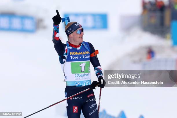 Johannes Thingnes Boe of Norway celebrates as he crosses the finish line for the gold medal during the Single Mixed Relay at the IBU World...