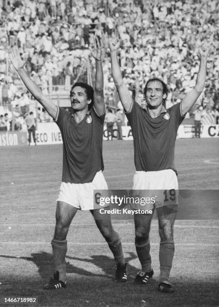 Claudio Gentile and Francesco Graziani of Italy celebrate with raised arms after winning their Group C match of the 1982 FIFA World Cup against...