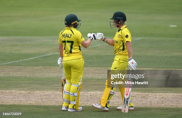 Beth Mooney of Australia interacts with team mate Alyssa Healy during the ICC Women's T20 World Cup group A match between Sri Lanka and Australia at...