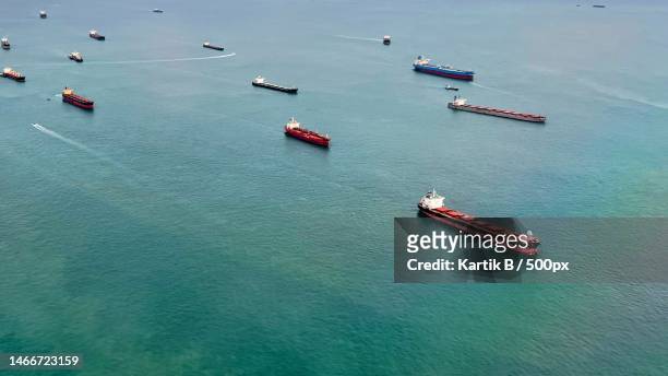 high angle view of boats in sea,singapore - camion citerne photos et images de collection