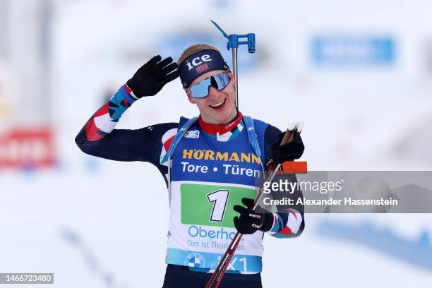 Johannes Thingnes Boe of Norway celebrates as he crosses the finish line for the gold medal during the Single Mixed Relay at the IBU World...