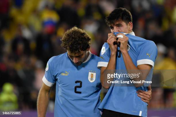 Uruguay's Juan Sebastian Bocelli and Facundo Gonzalez react after loosing the South American U-20 Conmebol Tournament match between Brazil and...