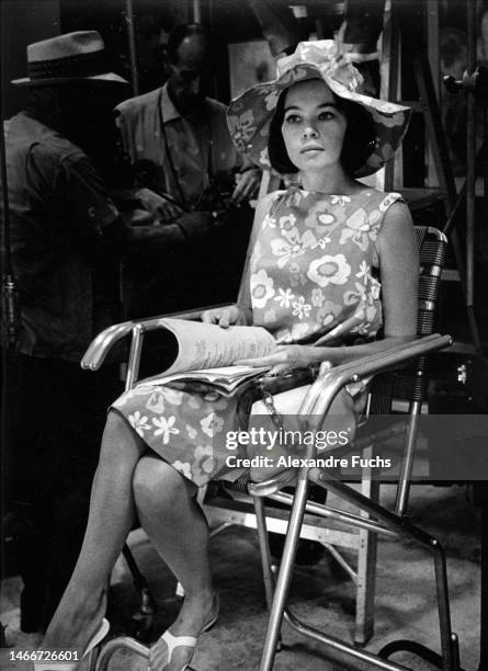 Actress Leslie Caron reading the script of "Father Goose" in 1964, at Ocho Rios, Jamaica.