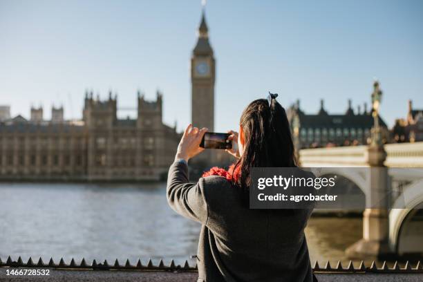 woman taking photo in city of london - big ben selfie stock pictures, royalty-free photos & images