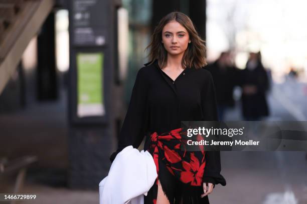 Leni Klum seen wearing a black oversized blouse, a white blazer, a red flowered skirt and black heels before the Michael Kors show on February 15,...