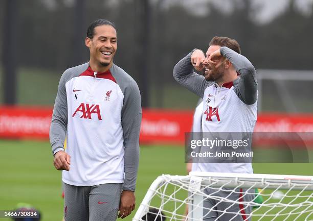 Virgil van Dijk and Jordan Henderson captain of Liverpool during a training session at AXA Training Centre on February 16, 2023 in Kirkby, England.