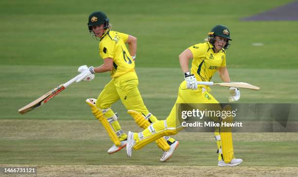 Beth Mooney and Alyssa Healy of Australia run between the wickets during the ICC Women's T20 World Cup group A match between Sri Lanka and Australia...
