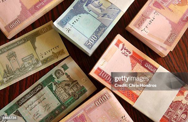 Neat piles of the new Afghan currency are shown at the Central Bank October 9, 2002 in Kabul, Afghanistan. Afghanistan introduced a new currency on...