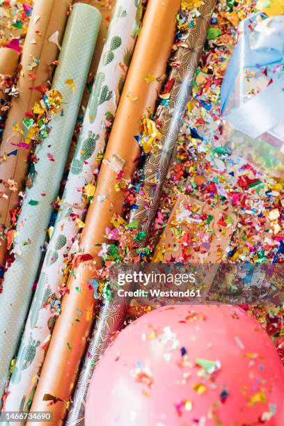 wrapping paper with confetti and balloons - roll of wrapping paper stock pictures, royalty-free photos & images